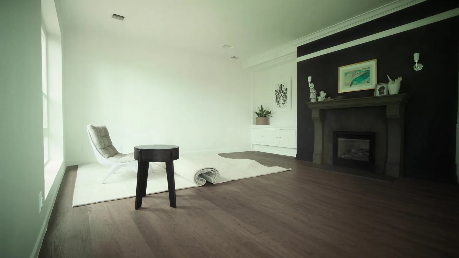 The same craftsman home after whole-home remodel — opened kitchen, renovated primary bath, refinished original fir floors