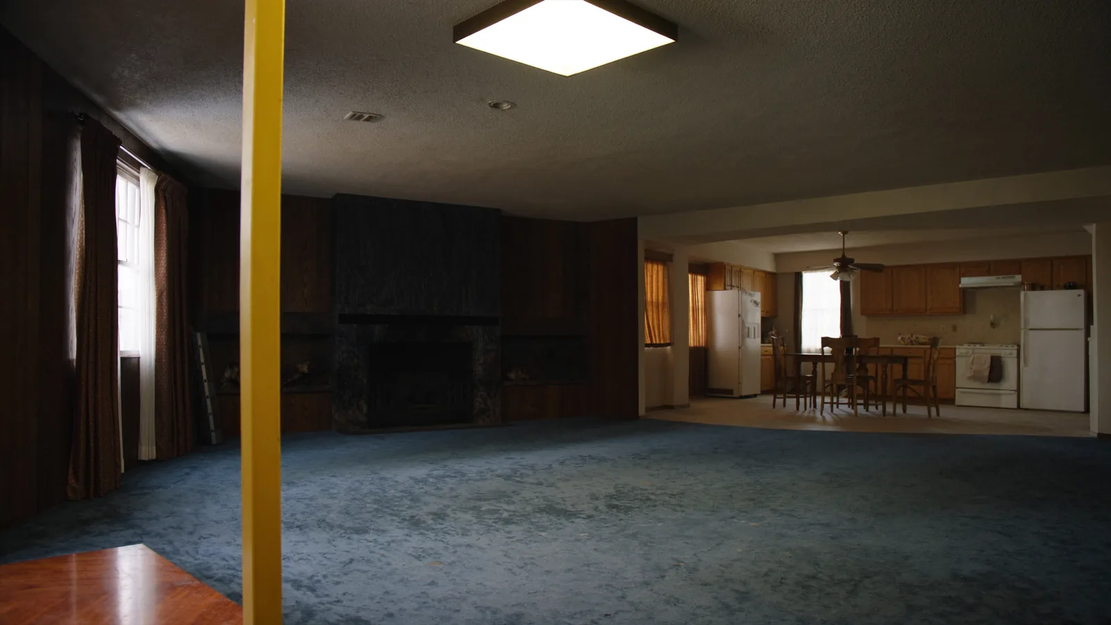 Dated 1970s Bellevue home before whole-home remodel — compartmentalized floor plan and worn finishes throughout